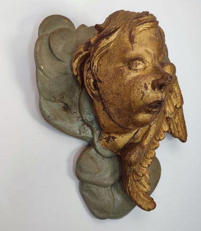 Putto in gilded wood and green lacquered...