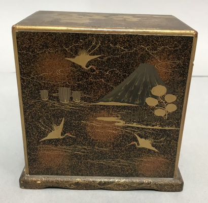 Small lacquered cabinet on a nashiji background,...