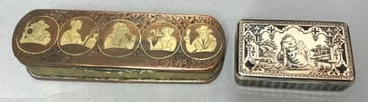 A copper and metal box decorated with characters...