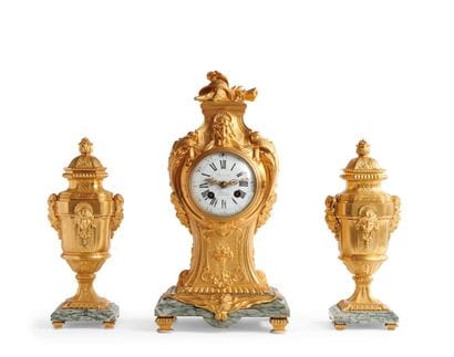 A chased and gilded bronze mantelpiece decorated...
