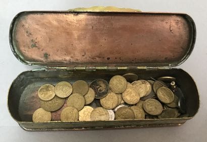 A copper and metal box decorated with characters...