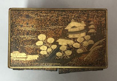 Small lacquered cabinet on a nashiji background,...