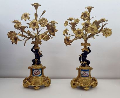 Pair of gilt bronze candelabras decorated...