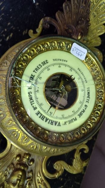 Bronze barometer with mascarons decoration,...