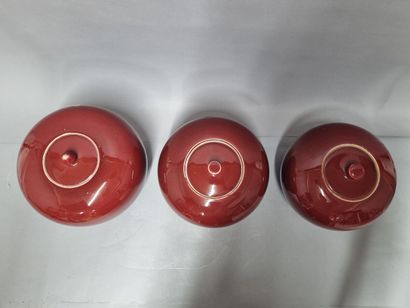 Set of three ginger pots in oxblood porcelain....