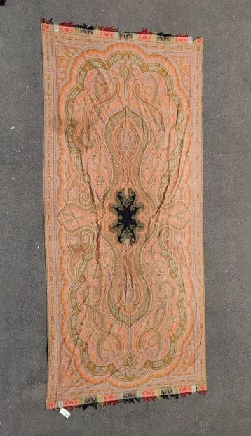 A fringed fabric with paisley on a red background
Height...