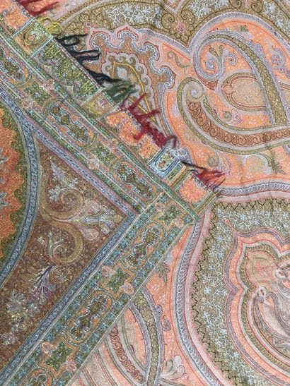 A fringed fabric with paisley on a red background
Height...
