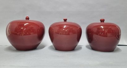 Set of three ginger pots in oxblood porcelain....