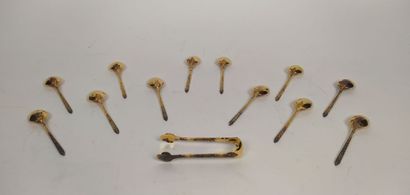 12 mocha spoons and sugar tongs in silver...