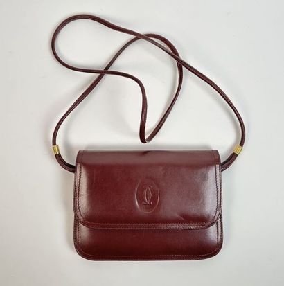 CARTIER -
Shoulder bag in burgundy leather,...