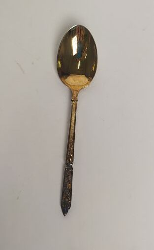 12 mocha spoons and sugar tongs in silver...