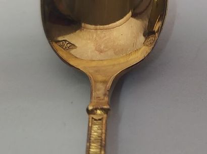 12 mocha spoons and sugar tongs in silver...