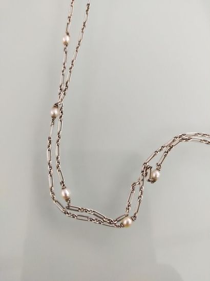 White gold long necklace decorated with small...