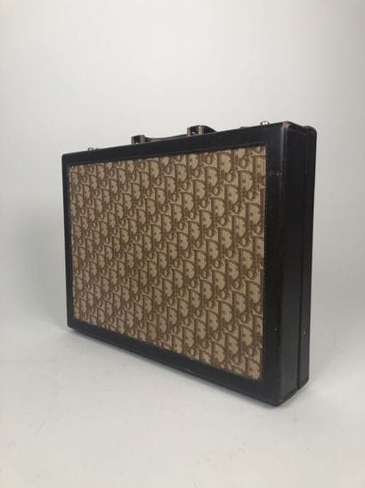 CHRISTIAN DIOR
Brown leather and signed canvas...