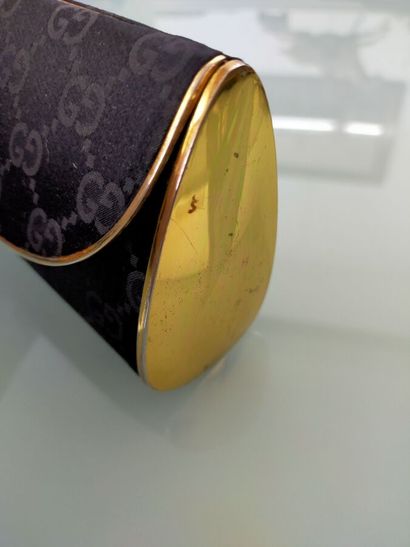 GUCCI
Evening clutch, gilded metal and black...