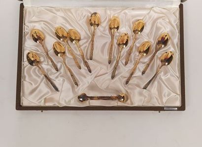 12 mocha spoons and sugar tongs in silver...