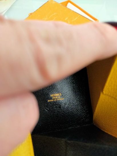 HERMES
Yellow and black leather Zulu folding...
