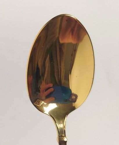 12 mocha spoons and sugar tongs in silver...