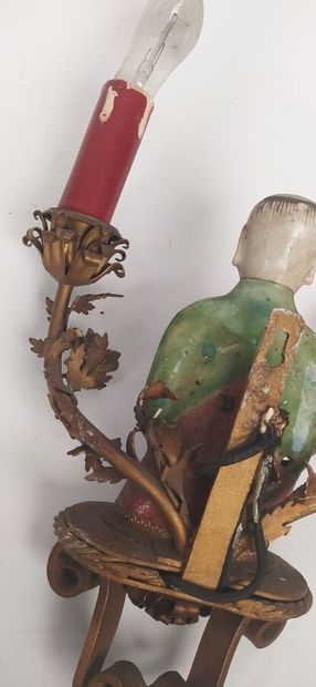 Pair of sconces in metal with subject in...