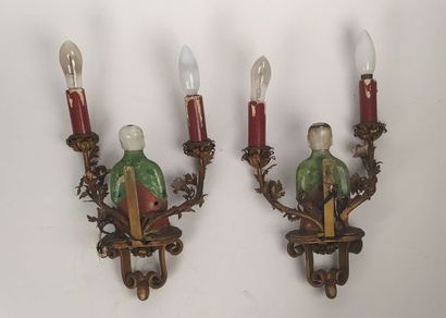 Pair of sconces in metal with subject in...