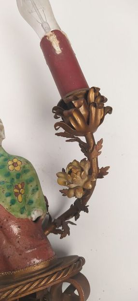 Pair of sconces in metal with subject in...