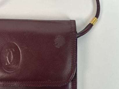 CARTIER -
Shoulder bag in burgundy leather,...