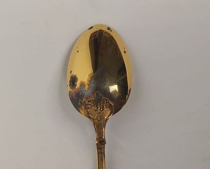 12 mocha spoons and sugar tongs in silver...