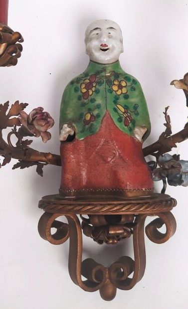 Pair of sconces in metal with subject in...