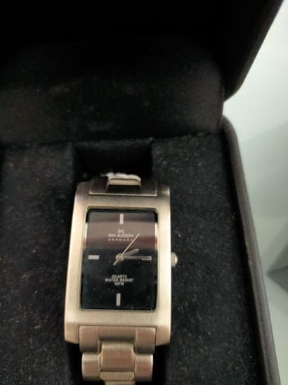 SKAGEN
Two rectangular metal men's watches...