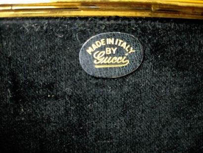 GUCCI
Evening clutch, gilded metal and black...