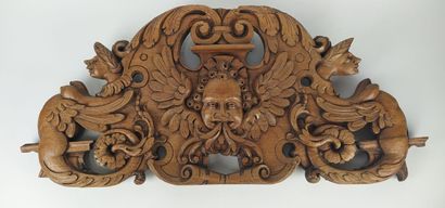 Sculpture on wood with cherub in bas-relief....