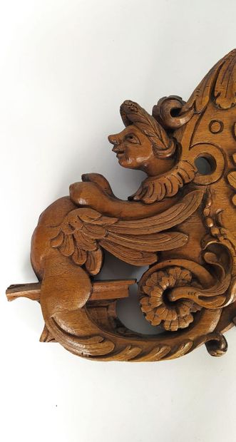 Sculpture on wood with cherub in bas-relief....