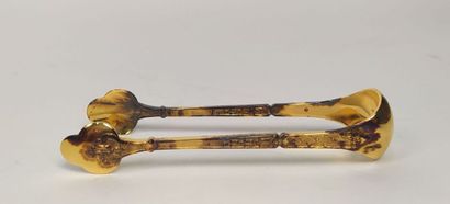 12 mocha spoons and sugar tongs in silver...