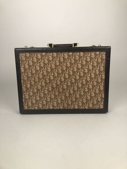 CHRISTIAN DIOR
Brown leather and signed canvas...