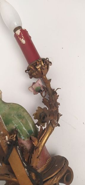 Pair of sconces in metal with subject in...