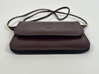 CARTIER -
Shoulder bag in burgundy leather,...