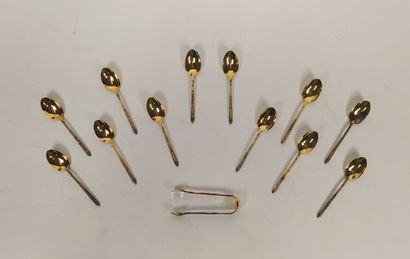 12 mocha spoons and sugar tongs in silver...