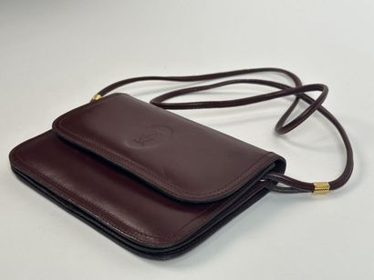 CARTIER -
Shoulder bag in burgundy leather,...
