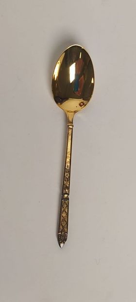 12 mocha spoons and sugar tongs in silver...