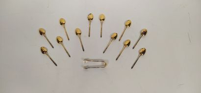 12 mocha spoons and sugar tongs in silver...