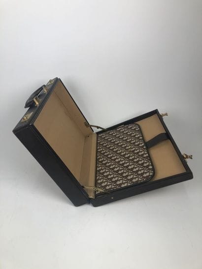 CHRISTIAN DIOR
Brown leather and signed canvas...