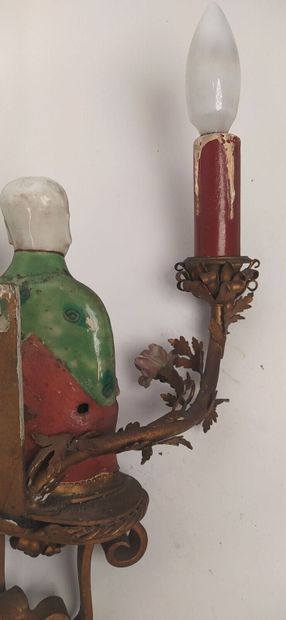 Pair of sconces in metal with subject in...