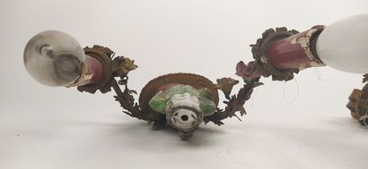 Pair of sconces in metal with subject in...