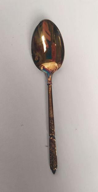 12 mocha spoons and sugar tongs in silver...
