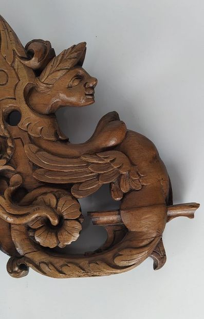 Sculpture on wood with cherub in bas-relief....