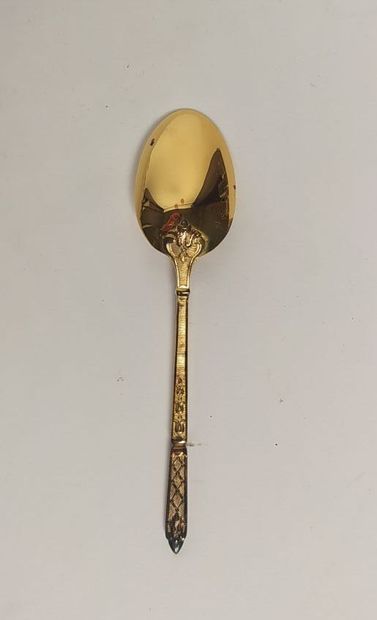 12 mocha spoons and sugar tongs in silver...