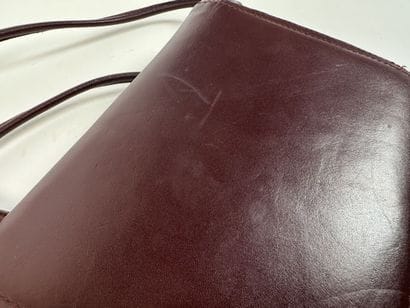 CARTIER -
Shoulder bag in burgundy leather,...