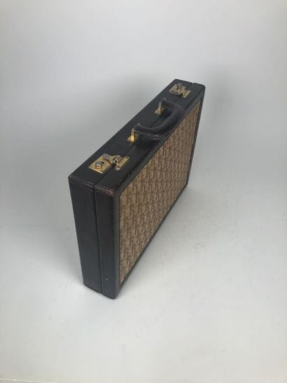CHRISTIAN DIOR
Brown leather and signed canvas...