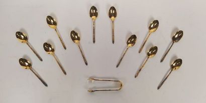 12 mocha spoons and sugar tongs in silver...