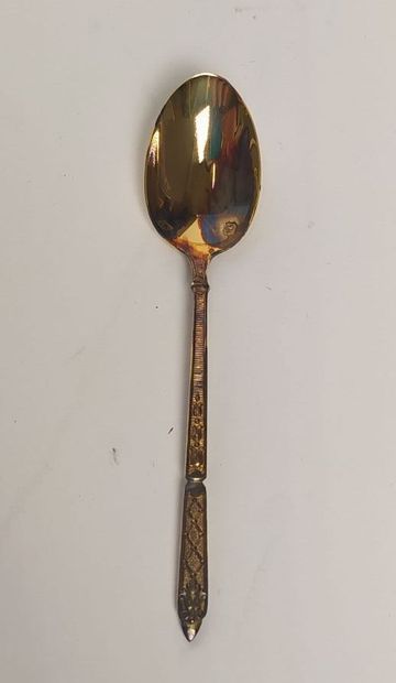 12 mocha spoons and sugar tongs in silver...